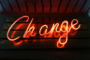 power of bad experiences, neon sign that says change