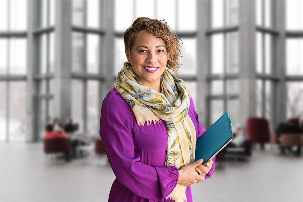 Branding Statements, image of a woman holding a folder smiling